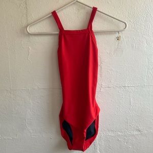 red leotard with crossed back